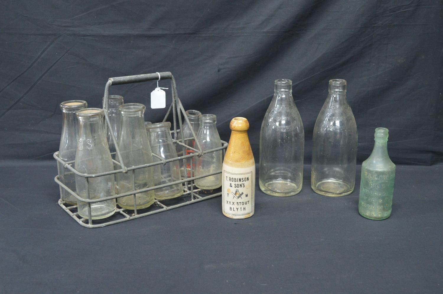 Vintage galvanised milk bottle basket to hold eight bottles together with eight various glass