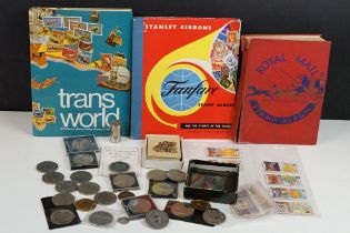 A box of mixed collectables to include stamps, cigarette cards, coins, banknotes...etc.