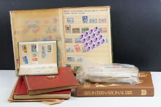 A collection of British, Commonwealth and world stamps contained within albums together with a small