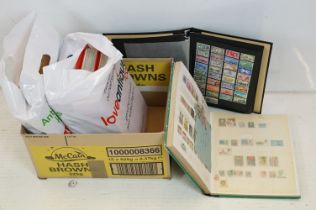 A large collection of British and World stamps contained within ten stamp albums.