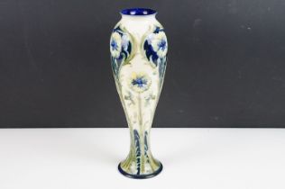 William Moorcroft for Macintyre Florian ware inverted baluster vase, with tubelined blue, green &