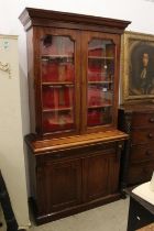 19th century Mahogany Bookcase Cupboard, the upper section with two glazed doors opening to three