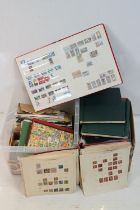 A large collection of British, Commonwealth and world stamps contained within stamp albums