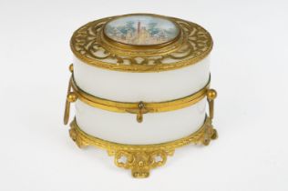 An antique opaque glass and gilt metal with central panel jewellery / trinket box / casket.