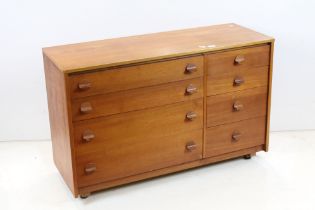 Mid century Retro Teak Chest of Four Long Drawers flanked by Four Short Drawers with round block