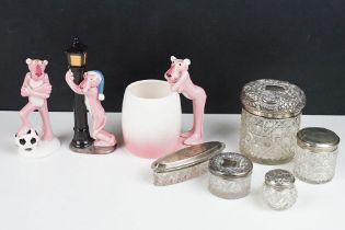 A selection of cut glass vanity jars with hallmarked silver tops together with a selection of Pink