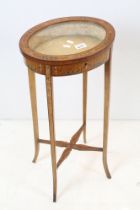 Sheraton Revival Small Satinwood Bijouterie Table, the oval hinged glazed top supported by slender