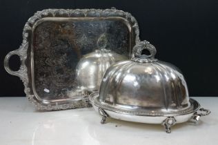 Silver plated cloche of typical domed form with cast scroll handle, together with a silver plated