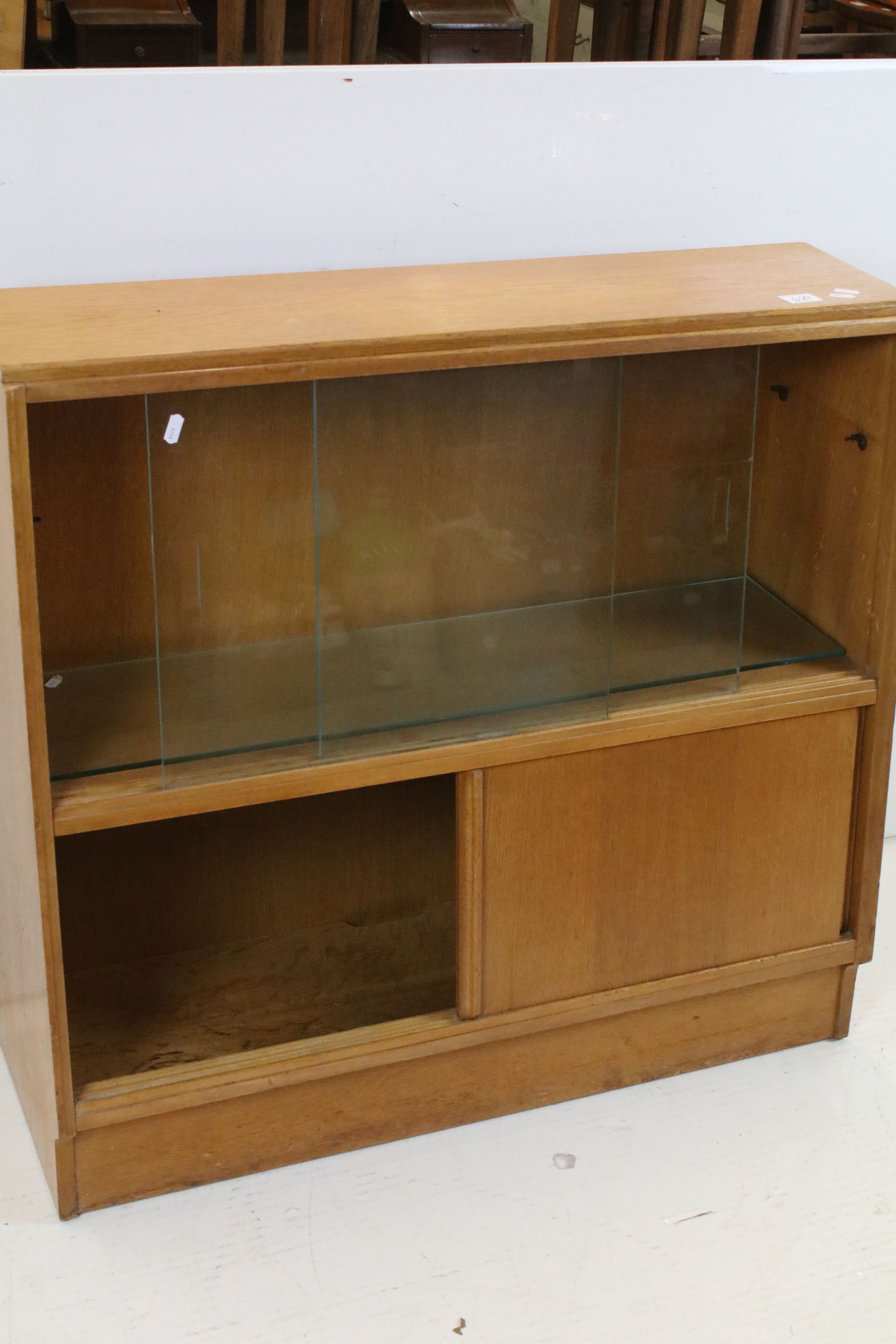 Mid century Oak Bookcase / Side Cabinet, the upper section with two glass sliding doors above two - Image 2 of 5