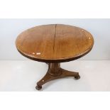 19th century Mahogany Circular Breakfast Table raised on a hexagonal column support with platform