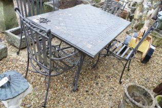 Metal framed tile top garden dining table complete with six matching metal work chairs. Table top