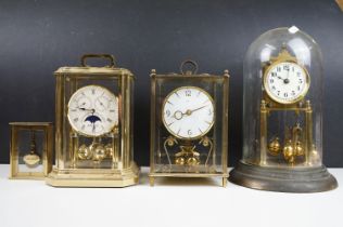 Group of four 20th Century anniversary clocks to include a glass domed example, a Sewills moon phase