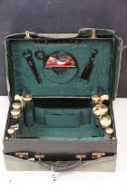 Early 20th century travelling vanity case, the fitted interior with contents to include eight