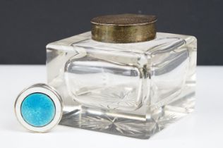 A large antique cut glass inkwell with hallmarked sterling silver top together with a sterling