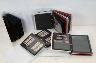 A collection of mainly world stamps mounted on stock sheets within four large albums.