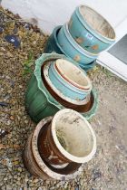 Group of nine assorted garden pots including a green glazed terracotta pot, moulded ring handle blue