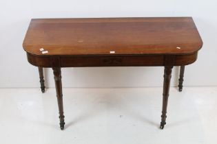 19th century Mahogany Side Table with rounded ends and raised on turned tapering legs terminating in