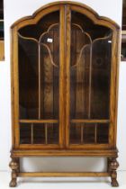 Art Deco Oak Display Cabinet with cloud shaped top, twin glazed doors (a/f) opening to three
