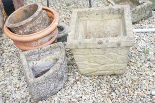 Group of four garden planters to include a terracotta pot with garland detailing, a smaller