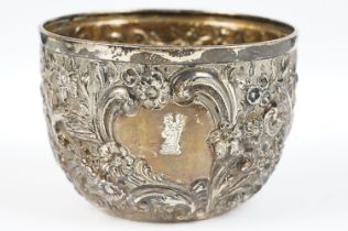 A fully hallmarked sterling silver bowl with floral and bird repouse design.