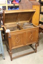 Early 20th century Oak ' Academy ' Gramophone Cabinet, the hinged lid opening to a turntable and