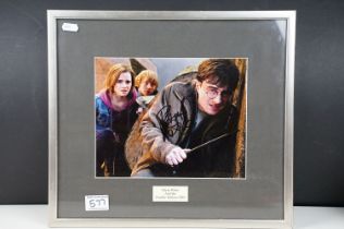 Signed Daniel Radcliffe Harry Potter and the Deathly Hallows 2010 photograph. Framed and glazed.