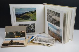 A collection of mainly early 20th century printed and real photo postcards to include many Surrey