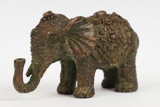 A Chinese bronze of an elephant in ceremonial armour.