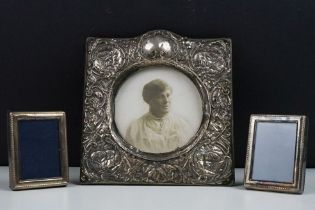 A fully hallmarked sterling silver photograph frame with Cherub decoration together with two smaller