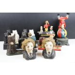 Collection of reproduction cast metal money banks and figurines to include Black & White whisky