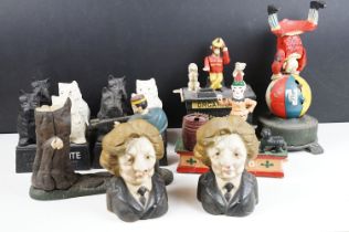 Collection of reproduction cast metal money banks and figurines to include Black & White whisky