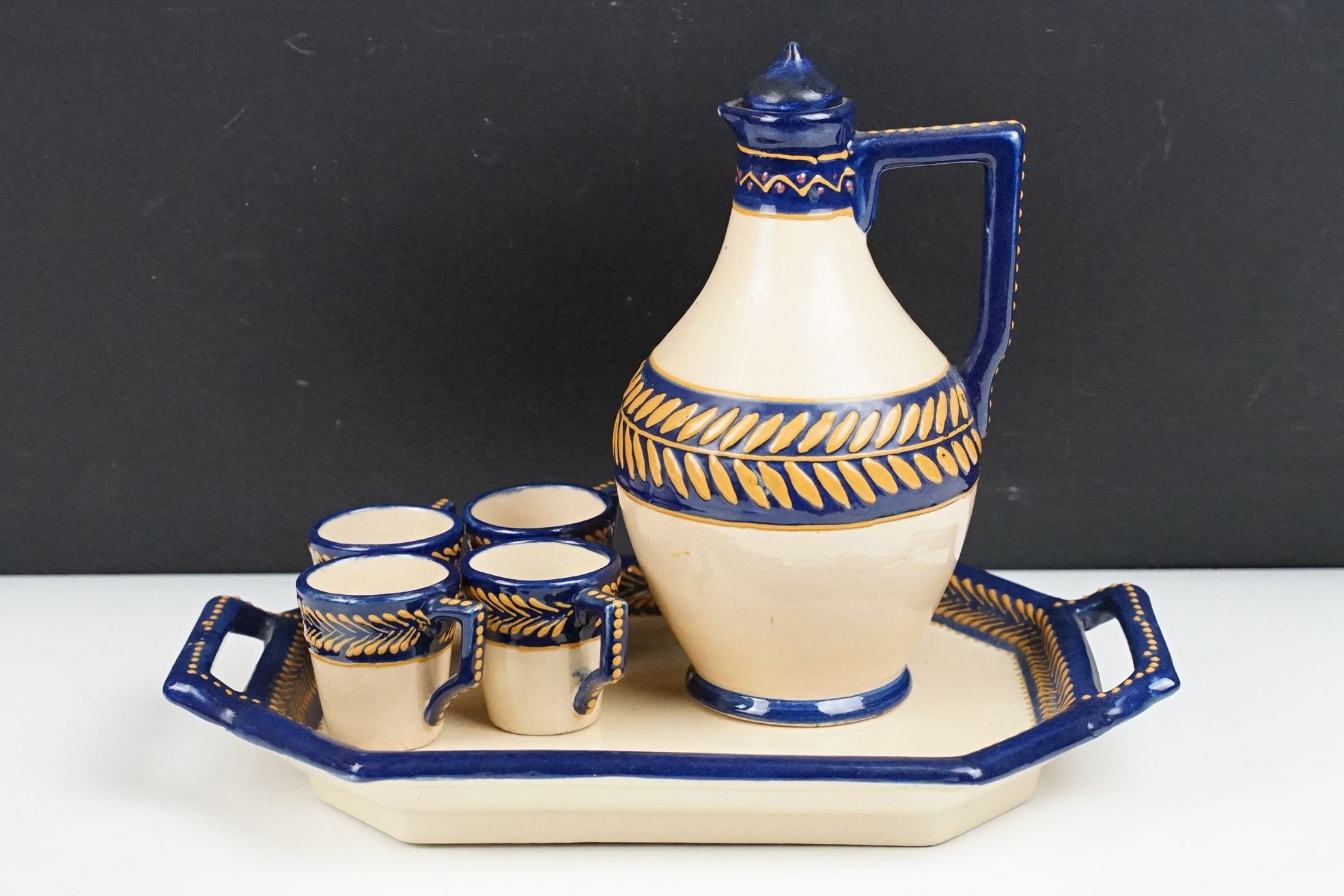 HB Quimper miniature tea set with blue glazing, to include ewer jug & stopper, 4 cups and a twin-