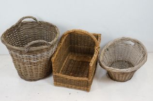 Three wicker baskets to include a large twin-handled log basket of tapering form (approx 50cm high),