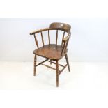 Late 19th / Early 20th century Elm Seated Captain's Chair with spindle back, 82cm high x 58cm wide