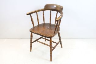 Late 19th / Early 20th century Elm Seated Captain's Chair with spindle back, 82cm high x 58cm wide