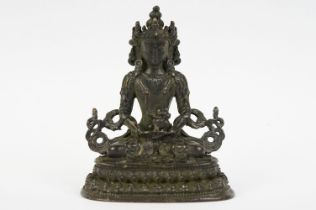 Buddhist bronze figure of Guan Yin in a seated pose