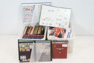 A large collection of British, Commonwealth and world stamps contained within stamp albums