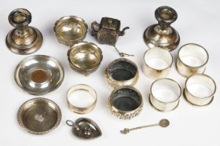 A collection of mainly fully hallmarked sterling silver to include napkin rings, salts, candlesticks