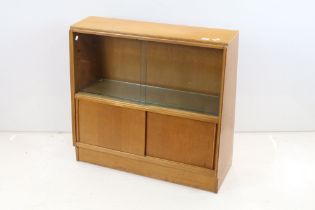Mid century Oak Bookcase / Side Cabinet, the upper section with two glass sliding doors above two