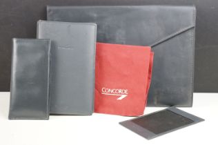 A collection of Concorde memorabilia to include glasses case, cushion cover, folder, card case....