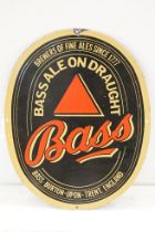 Bass on draught vintage advertising enamel sign, of oval form decorated with three enamel colours.