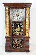 Early 20th Century American eight day pendulum wall clock by Seth Thomas having a mahogany case with