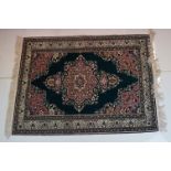 Dark Blue and Pink Ground Rug decorated with flowers and geometric patterns within a cream ground