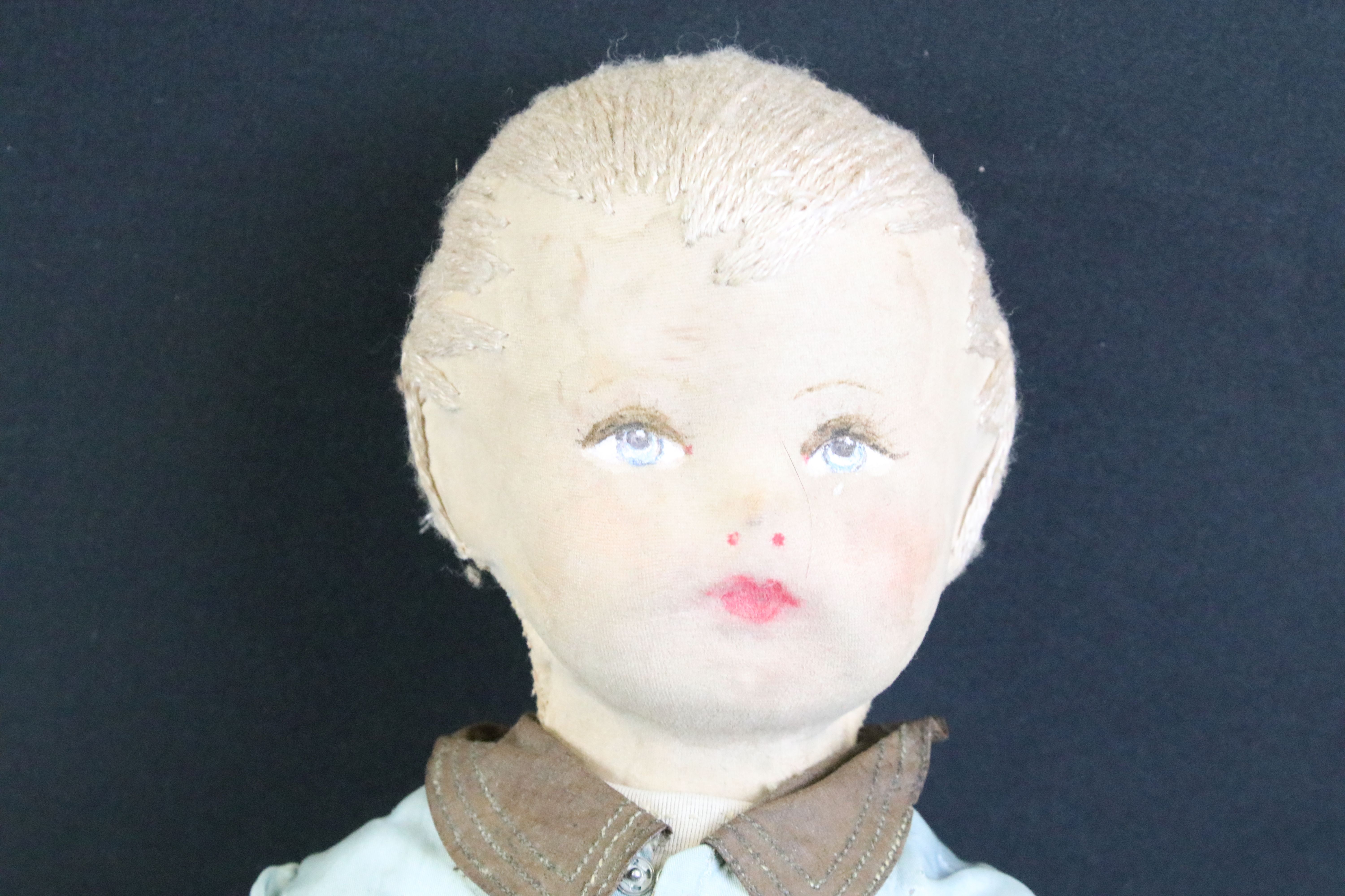 Pair of mid 20th C cloth covered dolls, clothed, with painted facial features and sewn hair. - Image 3 of 7