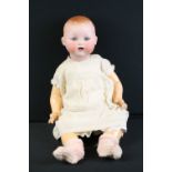 Early 20th C Armand Marseille baby doll with glass sleeping eyes, articulated composition limbs,