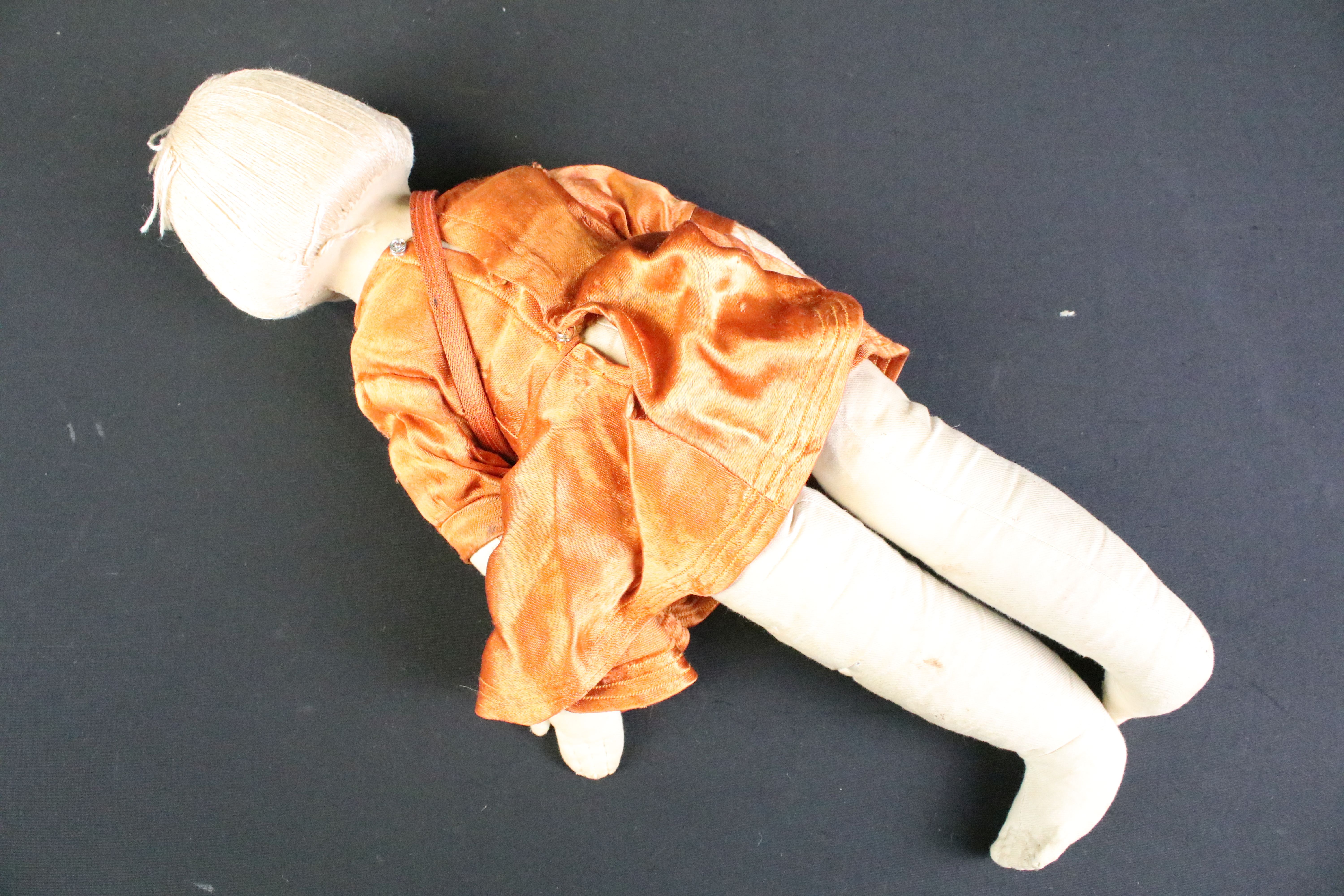 Pair of mid 20th C cloth covered dolls, clothed, with painted facial features and sewn hair. - Image 7 of 7