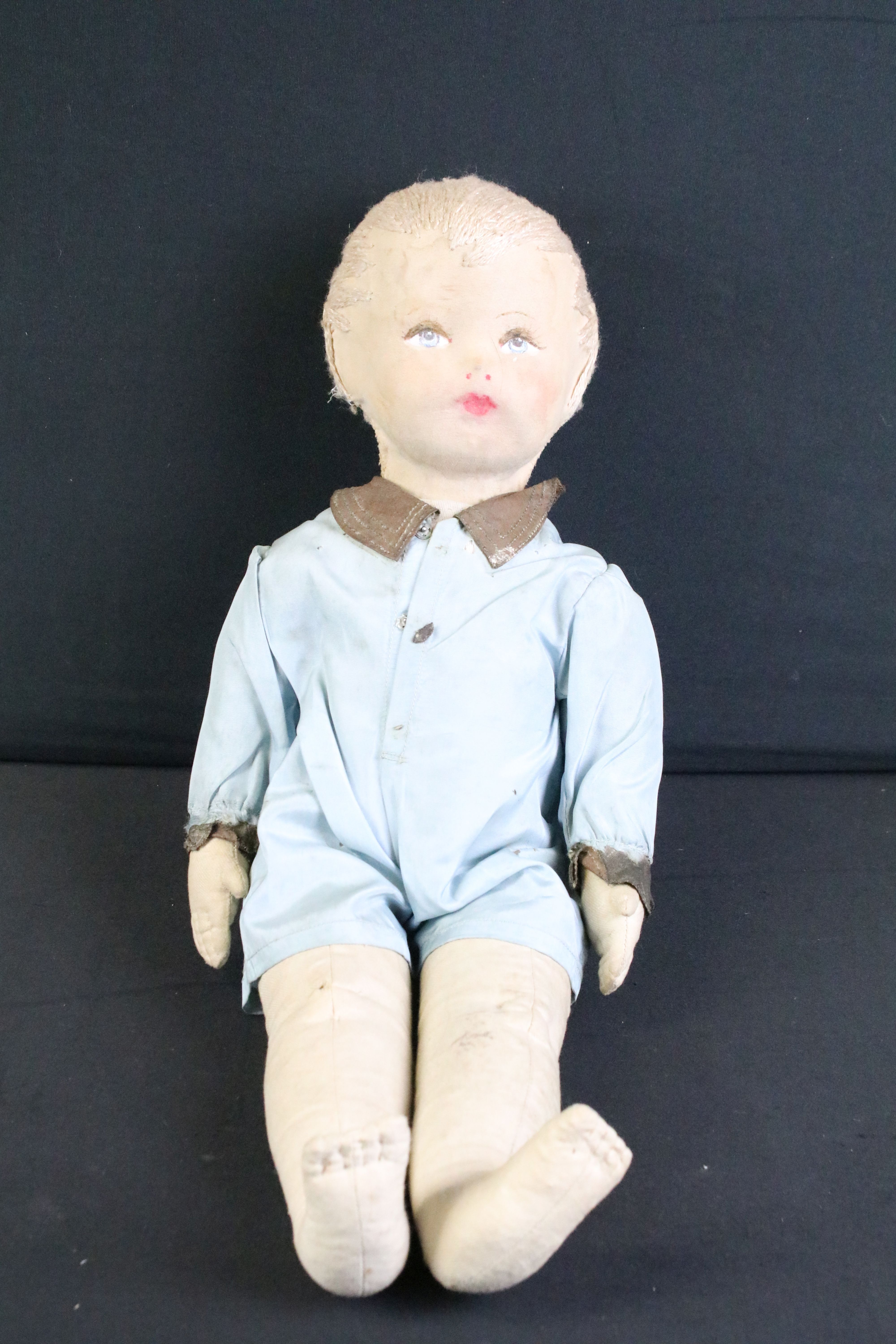 Pair of mid 20th C cloth covered dolls, clothed, with painted facial features and sewn hair. - Image 2 of 7