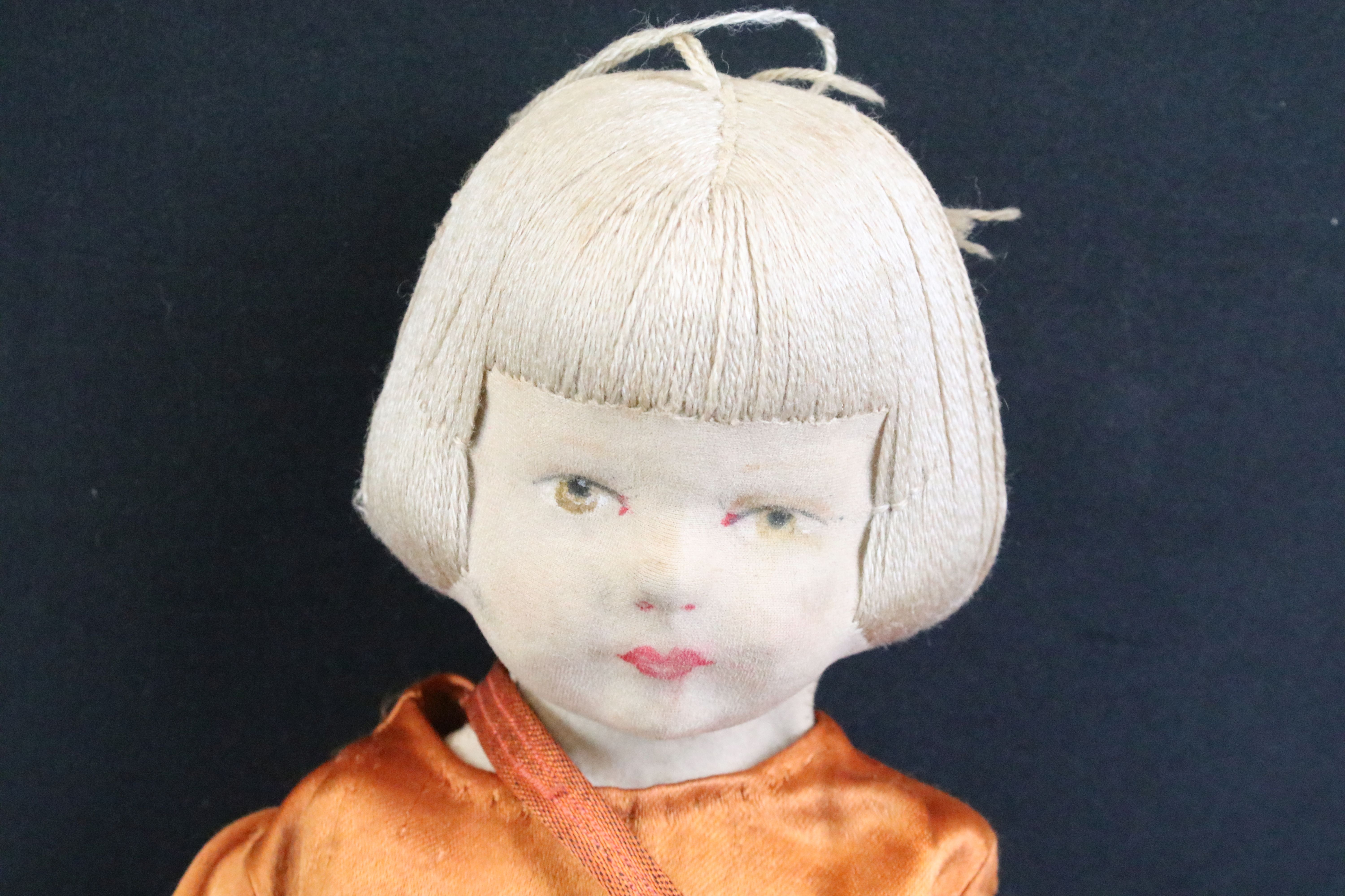 Pair of mid 20th C cloth covered dolls, clothed, with painted facial features and sewn hair. - Image 6 of 7