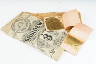 A Quantity of gold leaf contained within paper envelopes.