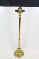 Gothic Brass Standard Candle Holder, 107cm high together with an Arts and Crafts style Brass